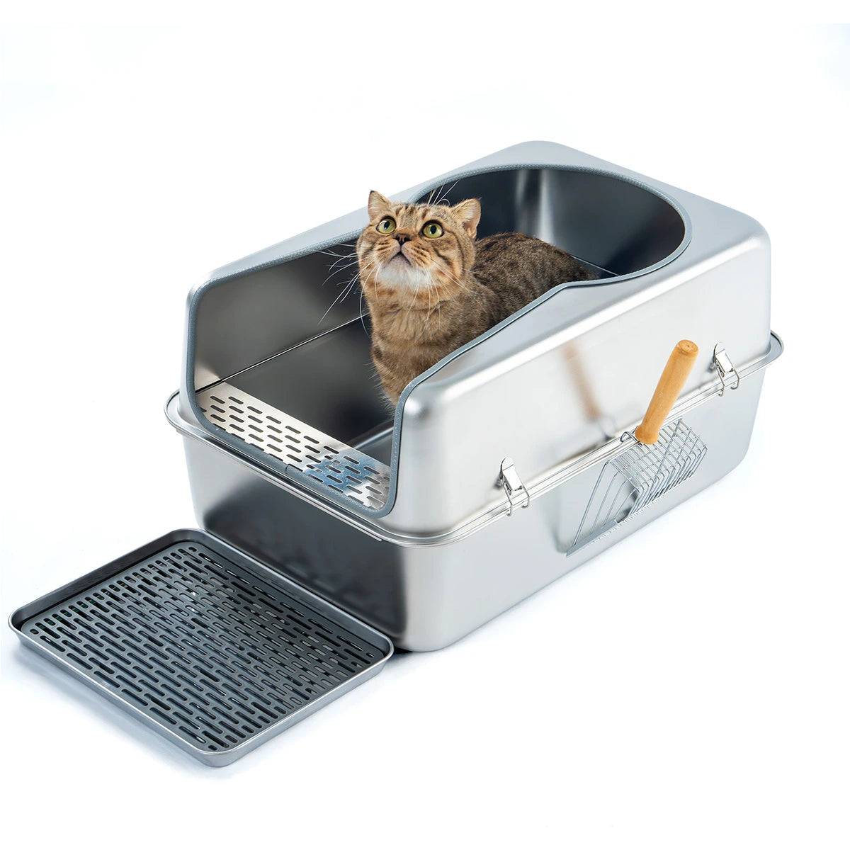 Cat sitting inside a metal litter box with a removable grate and attached scoop.